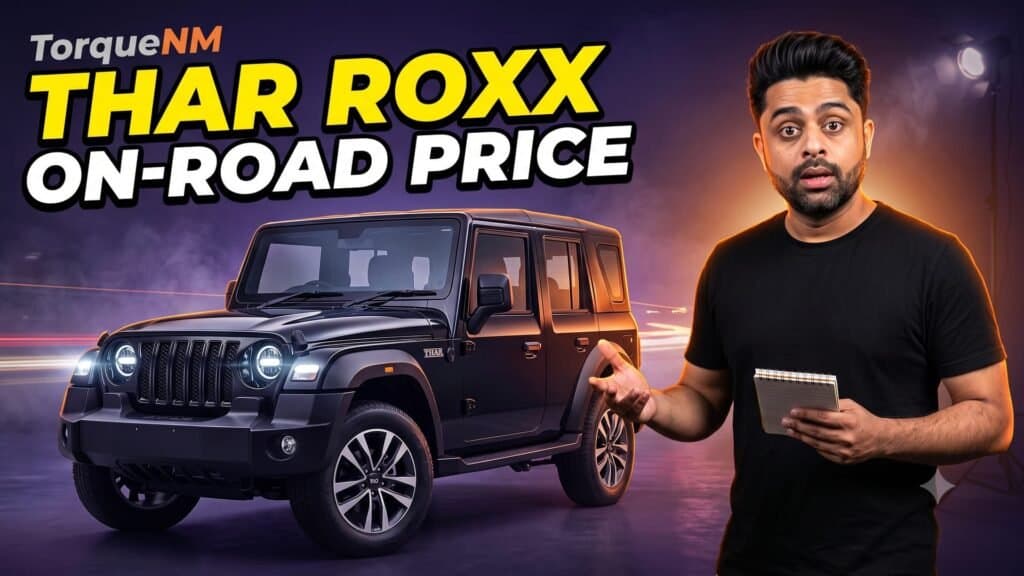 Thar Roxx on-road price thumbnail: the TorqueNM presenter pointing at a black Mahindra Thar Roxx with a notepad