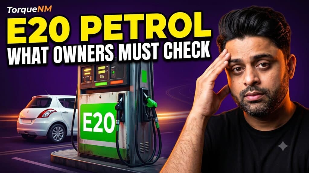 Fuel dispenser labelled E20 with a hatchback behind it