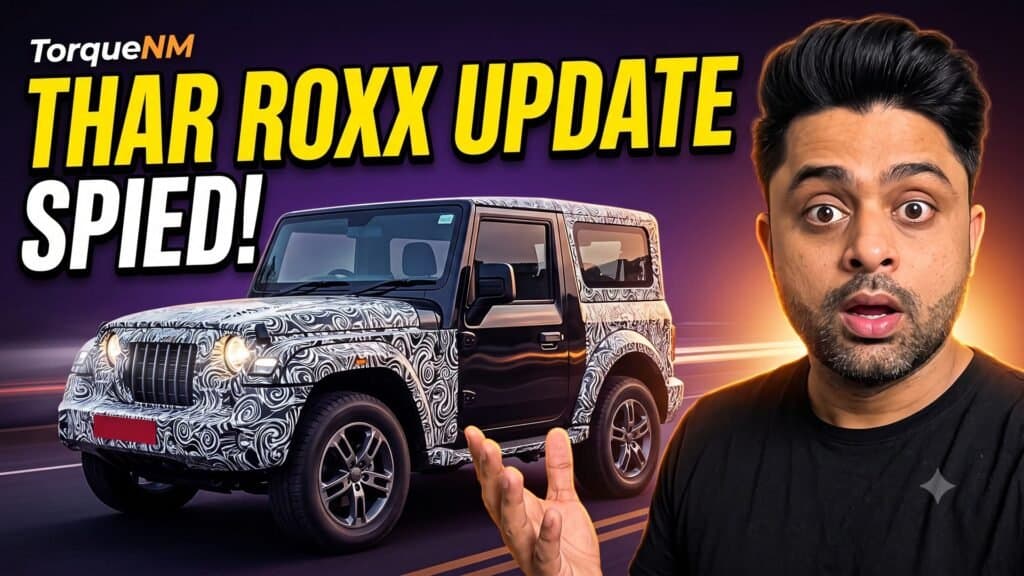 Shocked presenter beside a camouflaged Mahindra Thar with the headline Thar Roxx Update, Spied!